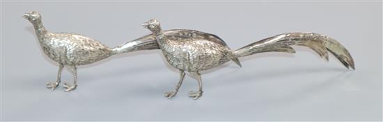 A pair of early 20th century Hanau silver model peacocks, import marks for Chester, 1902, (one tail repaired), 4.5 oz.